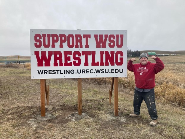 2021 Coach Phil with Support WSU Wrestling Sign